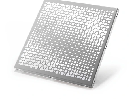 Decorative aluminum panel with a repeating pattern of large and small circular perforations