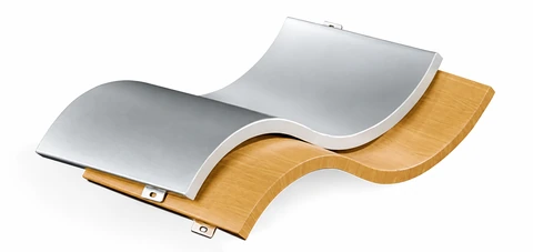 Double-curved aluminum cladding panels with silver and wood-grain finishes and visible fixing tabs