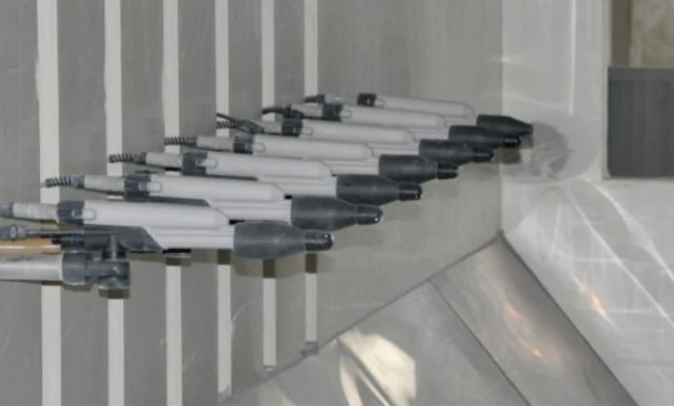 Automatic spray guns applying liquid paint