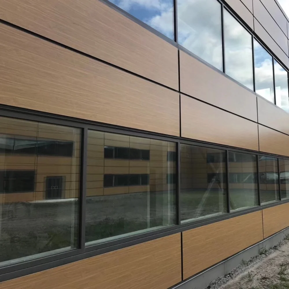 Wood-look facade panels with regular joints around windows
