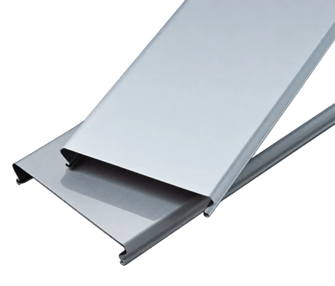 Stacked silver C-shaped aluminum ceiling strips with folded side edges