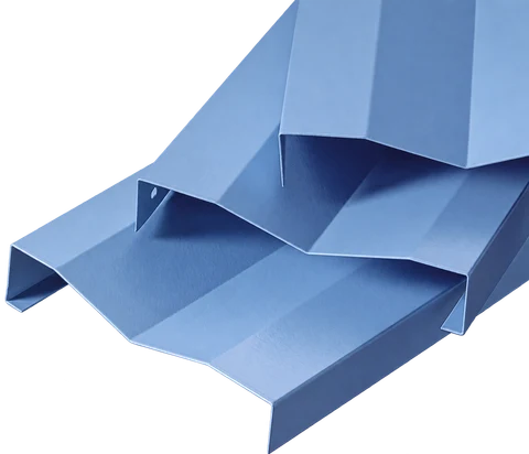 Blue custom-shaped aluminum ceiling baffles showing angular folded sections