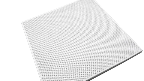Perforated aluminum panel with closely spaced round holes and folded perimeter edges