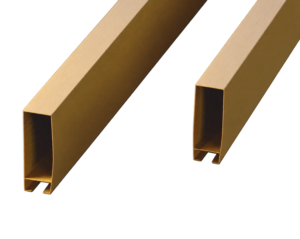 Gold-colored rectangular aluminum ceiling baffles showing hollow profile ends