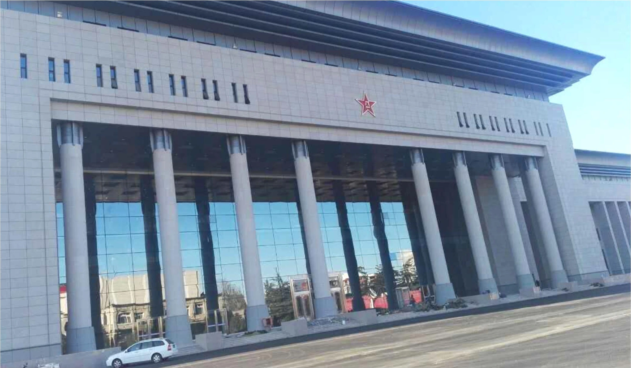 Colonnaded entrance and horizontal roof fascia at a Beijing airport terminal