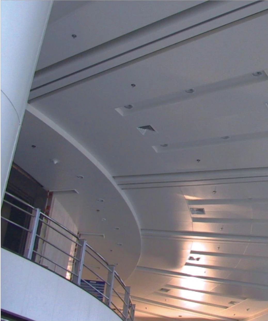 Curved interior balcony and ceiling panel joints in a Hubei office building