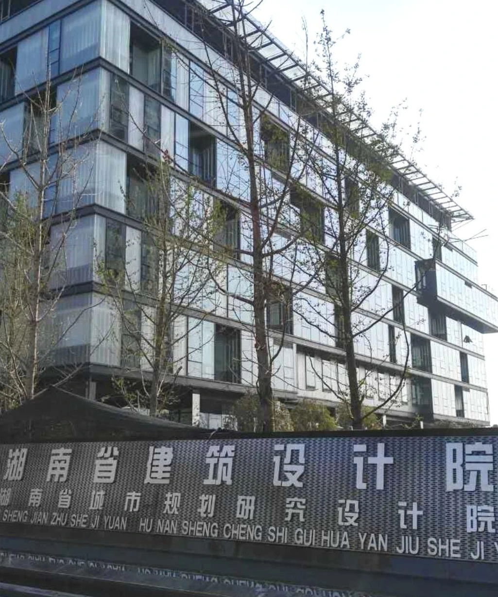 Street view of a design-institute office facade with glazed window bays in Changsha