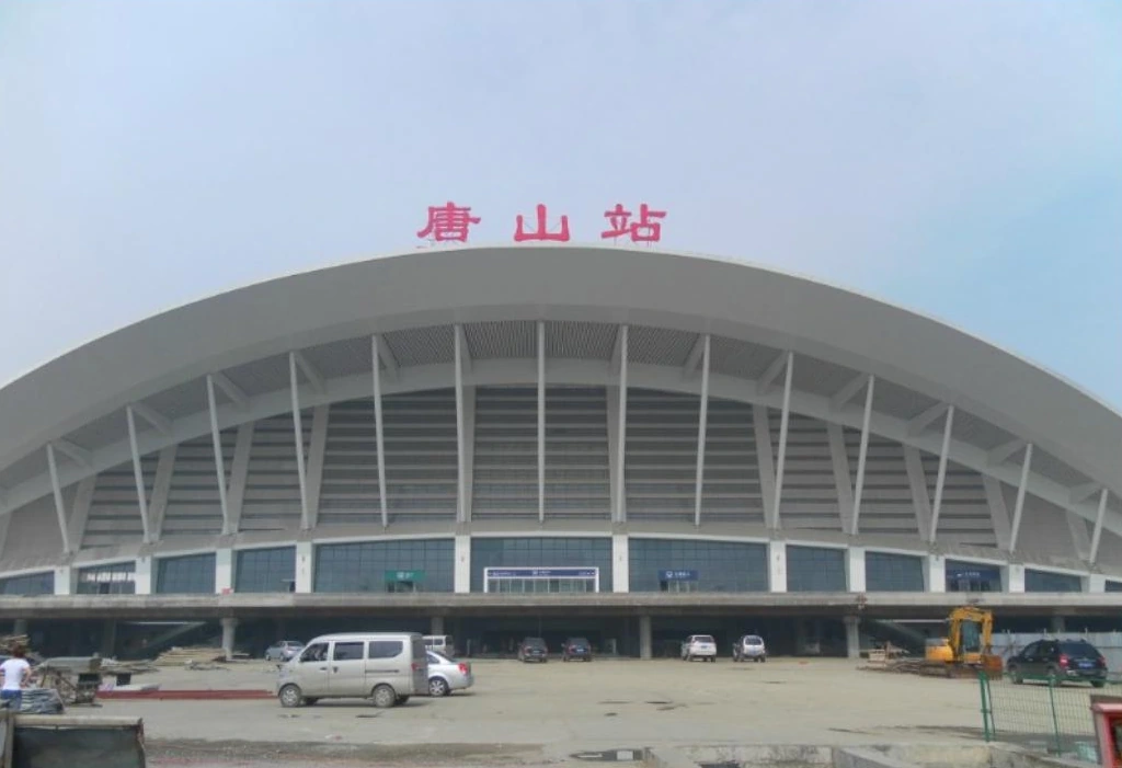 Wide arched station entrance with supporting columns at Tangshan railway station