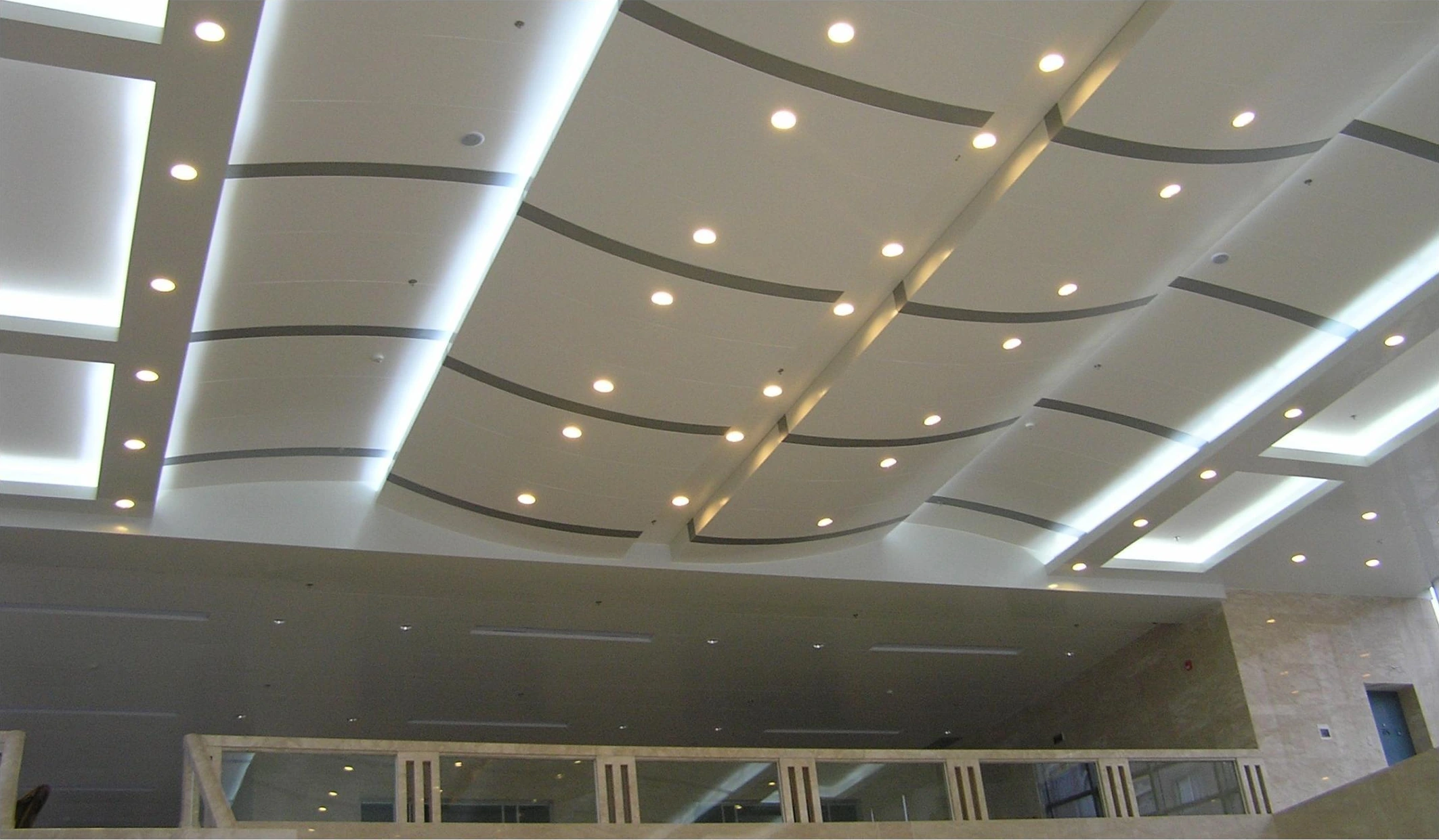 Ceiling panel bays with recessed lights and illuminated borders in a Tianjin hospital lobby