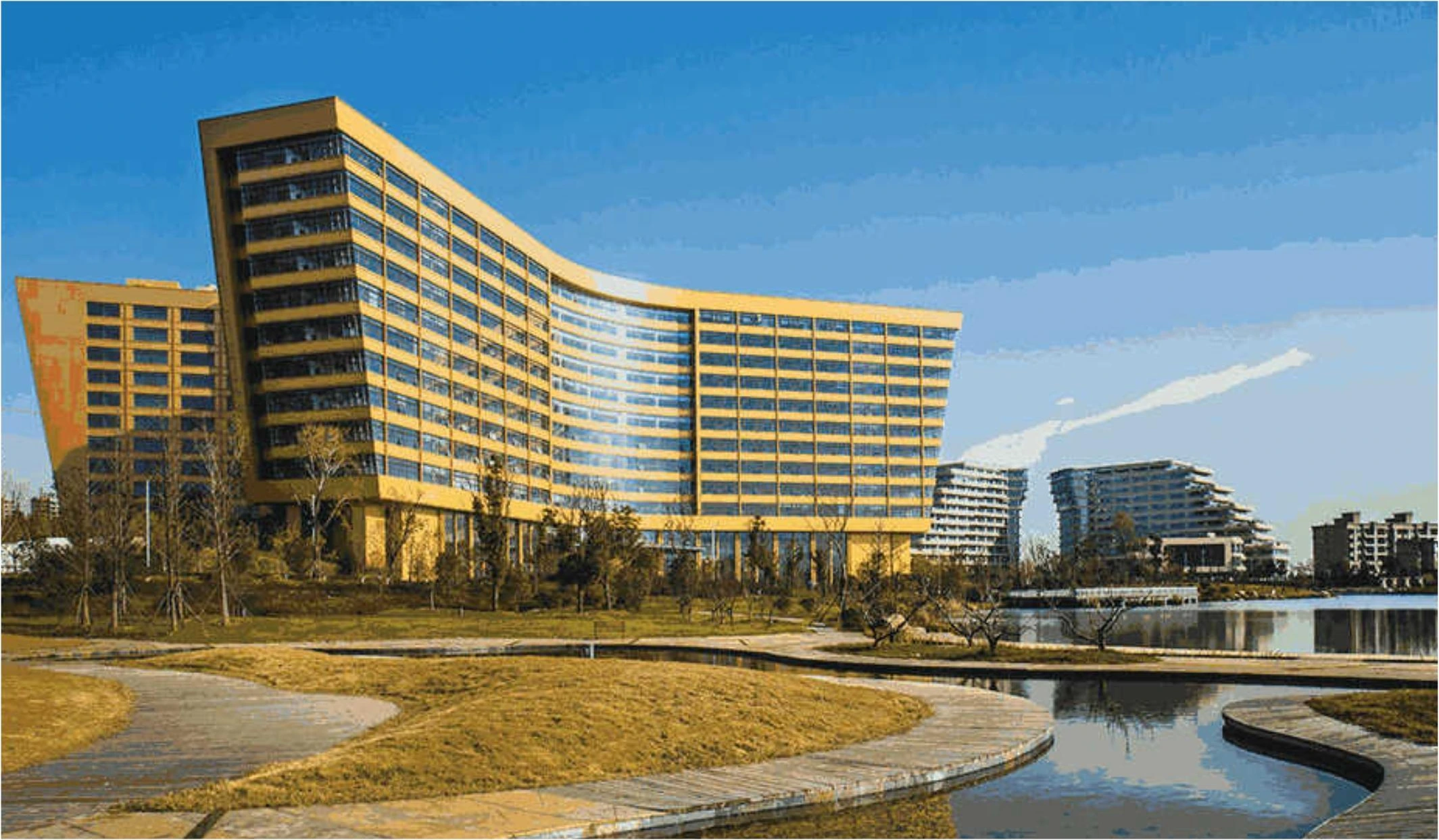 Gold-toned facade bands on a curved university building overlooking a lake in Hefei