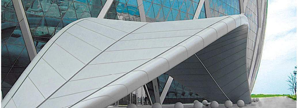 Double-curved aluminum panels forming a sweeping canopy at a public building entrance
